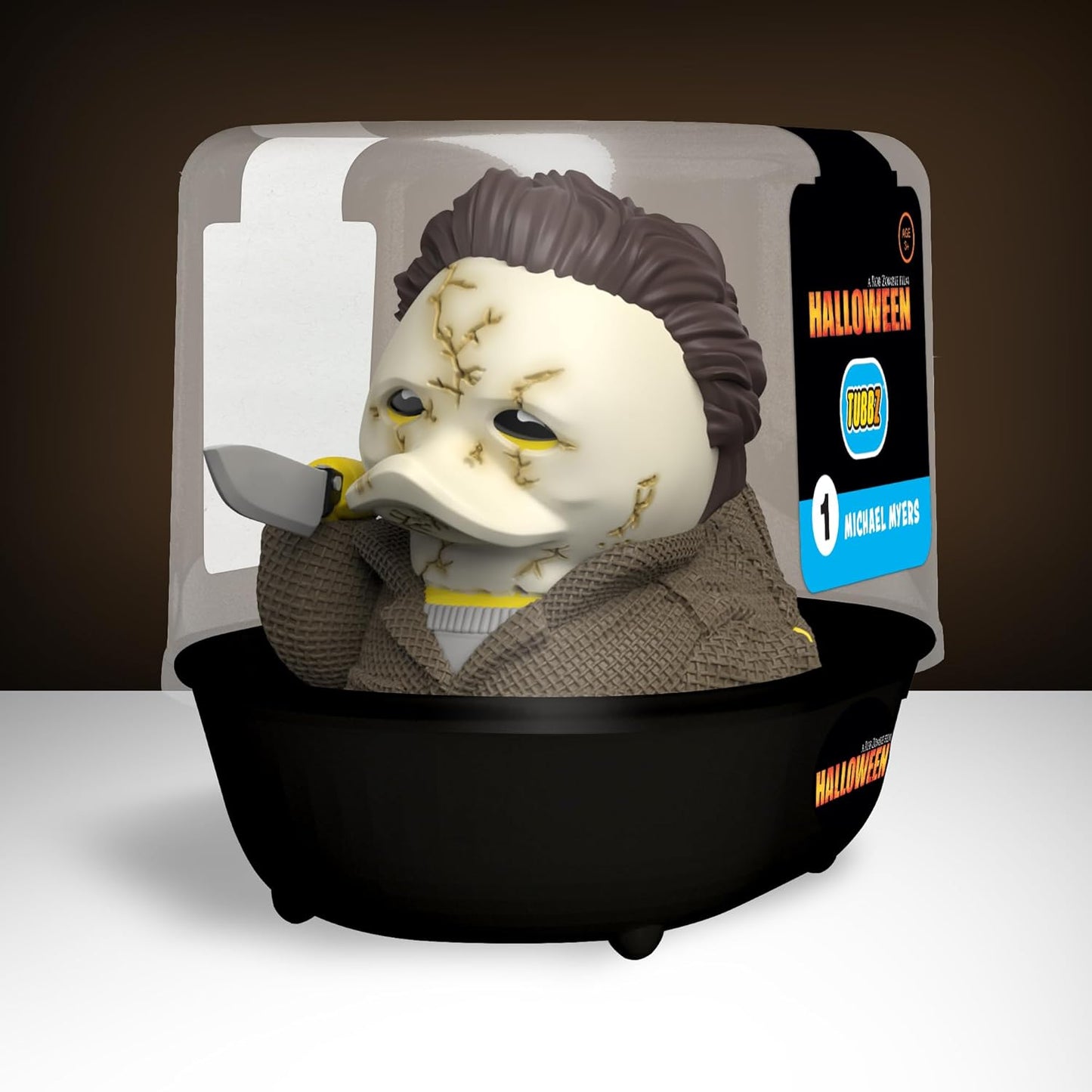 Horror movie character mask in a display case with 'Halloween' branding.