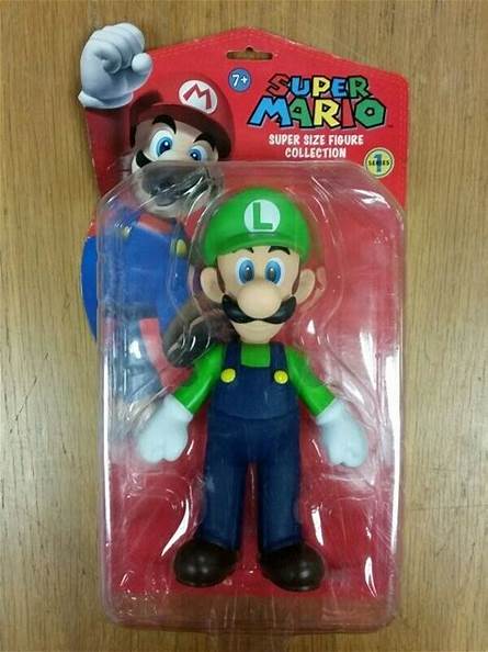 Super Mario Luigi action figure in packaging on a wooden surface