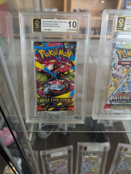 Pokémon trading card packs in protective cases with grading labels.