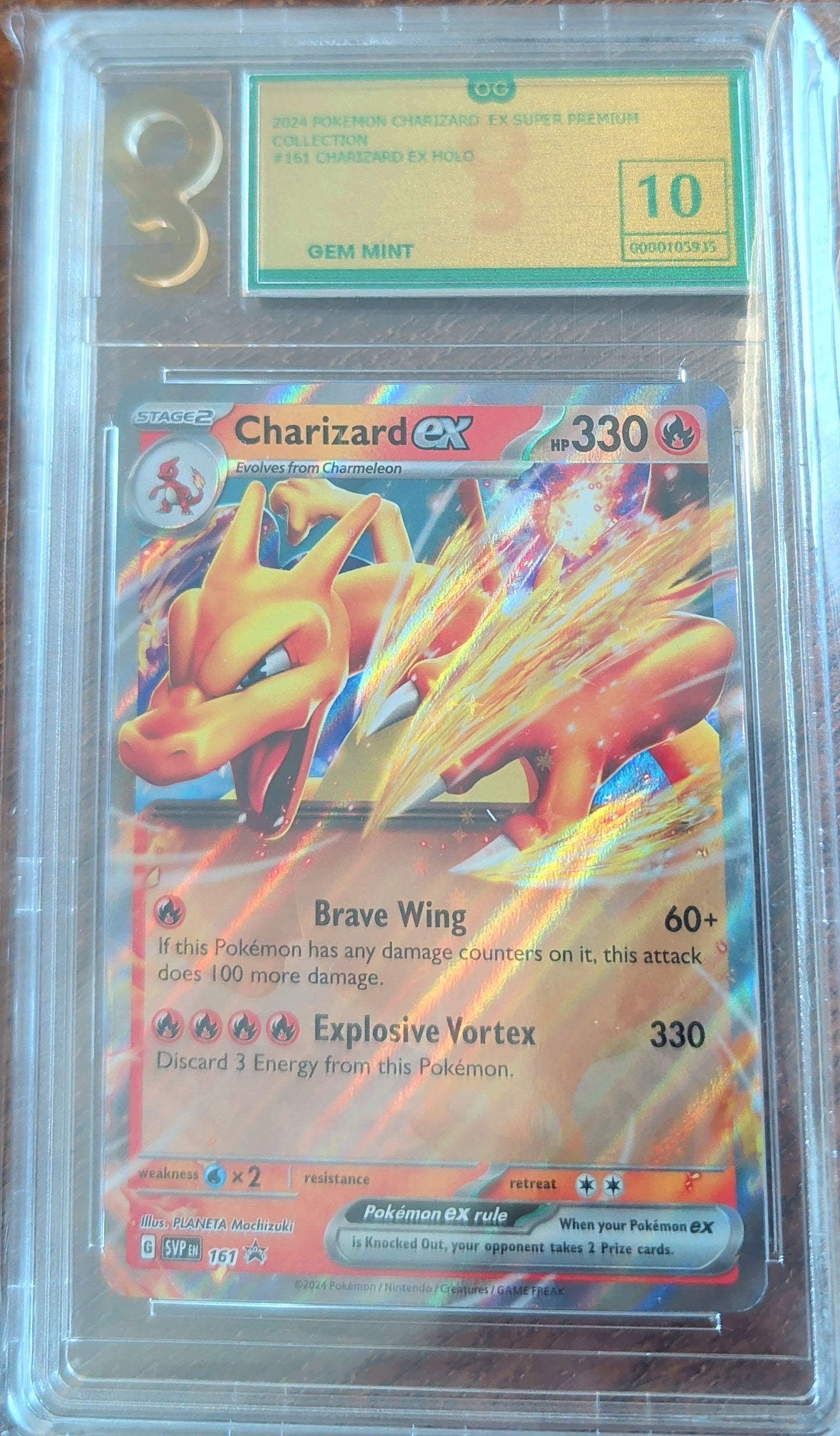 Pokémon trading card featuring Charizard EX with a grading label on a reflective surface.