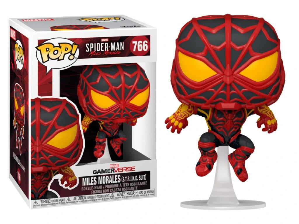 Spider-Man figurine with red and black design next to its packaging