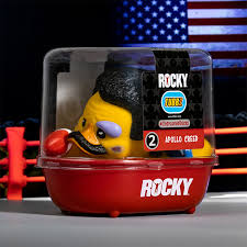 Rocky toy figure in a clear container with an American flag in the background
