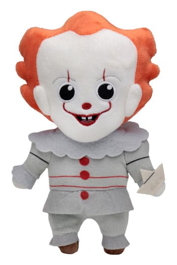 Plush toy resembling a clown with red hair and white face on a white background
